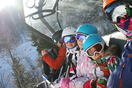 sporting family in equipment at a ski resortの写真素材