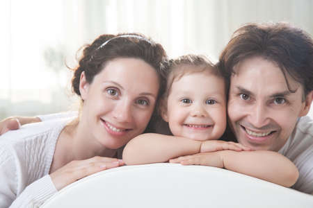 portrait of young family with Little cute girlの写真素材
