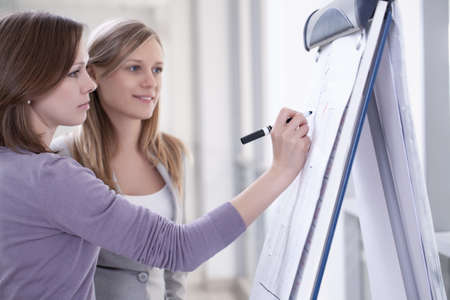 Contemporary business woman working in team in the officeの写真素材
