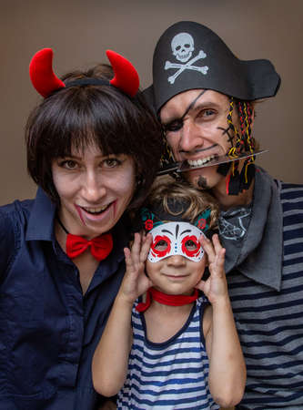 family celebrates halloween at home