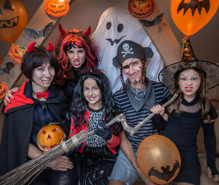 family celebrates halloween at homeの写真素材