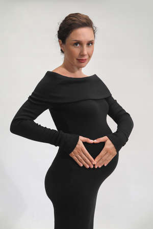 Young beautiful pregnant woman waiting for the birth of her baby.