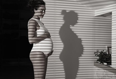 Young beautiful pregnant woman waiting for the birth of her baby.