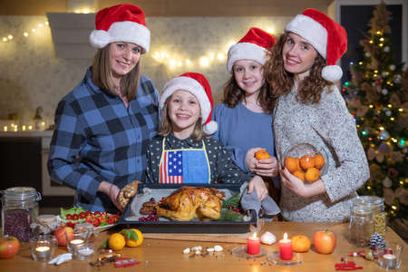 The female part of the family prepared a Christmas Goose for Christmas dinner at homeの写真素材