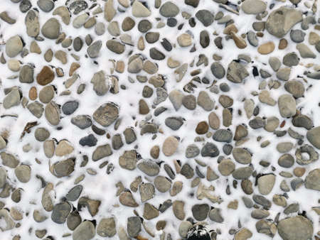 beautiful photo of a sea pebble covered with snow. photowall-paper.の写真素材