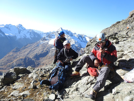 group of mountaineers with backpacks climbing to the mountainの写真素材