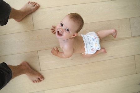 newborn baby crawling on the floor alone