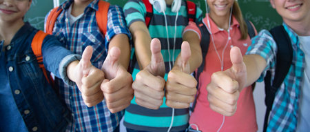 group students shows OK gesture in the schoolの写真素材