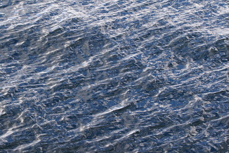 beautiful range of blue shades on the wavy sea water surface.の写真素材