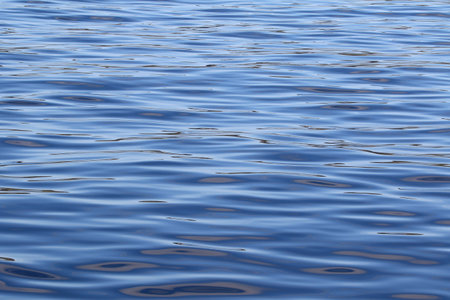 beautiful range of blue shades on the wavy sea water surface.の写真素材