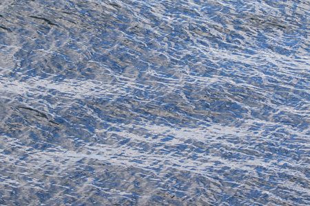 beautiful range of blue shades on the wavy sea water surface.の写真素材