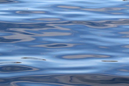 beautiful range of blue shades on the wavy sea water surface.の写真素材
