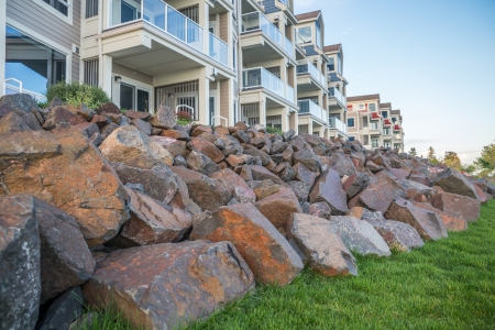 Rock piles in front of a building of luxury appartmentsのeditorial素材