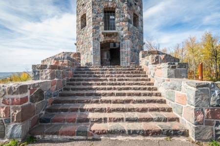 Front entrace of a stone tower during autumn timeのeditorial素材