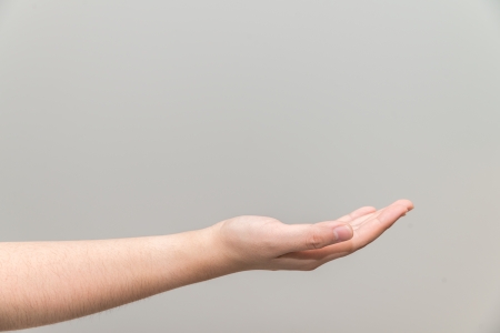 Human hand with open palm ready to recieveの写真素材