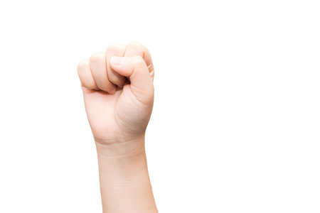 Human hand with closed fist on gray backgroundの写真素材