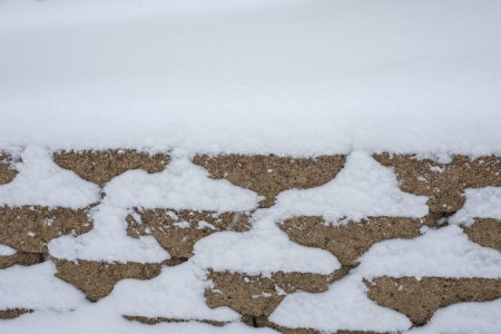 Stacks of brick wall in a heavy snowy day