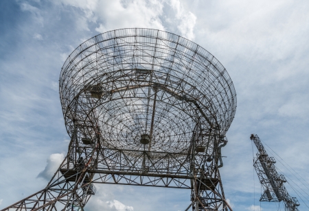 Base of a large astronomy radar with skyの写真素材