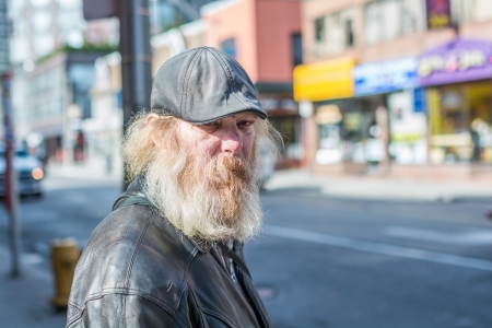 TORONTO, ON, CANADA - OCTOBER 30:  Homeless man wonder aimlessly alone on Young Street, in Toronto Canada on October 30, 2013のeditorial素材
