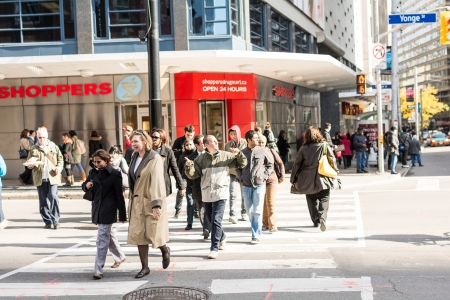 TORONTO, ON, CANADA - OCTOBER 30:  People crossing a street, in Toronto Canada on October 30, 2013のeditorial素材