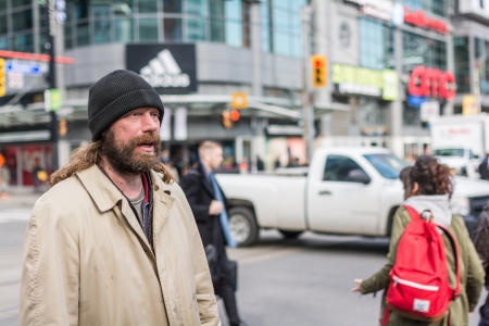 TORONTO, ON, CANADA - OCTOBER 30: Pedestrians crossing a busy intersection near Dundas Square on Young Street, in Toronto Canada on October 30, 2013のeditorial素材
