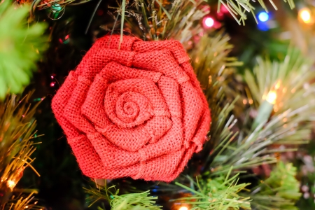 Christmas decorations and lights hanging on a Christmas treeの写真素材