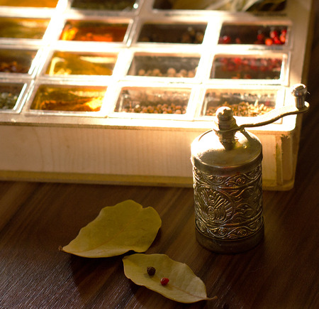 Mix spices in a wooden box with a millの写真素材