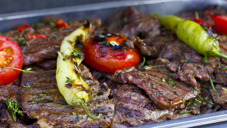 Beef grilled with peppers and tomatoes