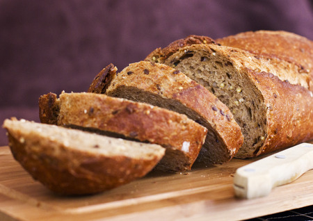 Rye bread with cereals on the wooden table