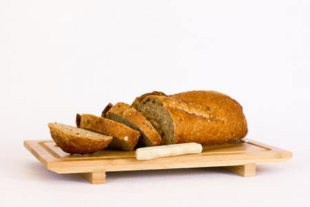 Rye bread with cereals on the wooden tableの写真素材