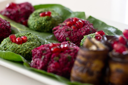 Rolls of eggplant with a filling of walnuts, Georgian snack pkhali of spinach and beet with herbs...