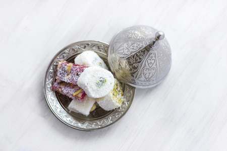 Traditional Turkish sweets lukum on silver saucer with lidの写真素材
