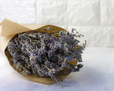 Bouquet of dried lavender in a brown wrapping paperの写真素材
