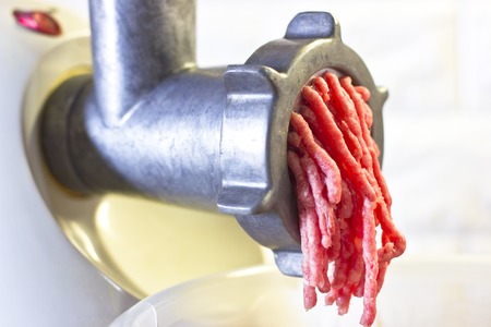 Process of fresh red meat grinding from a mincing machineの写真素材