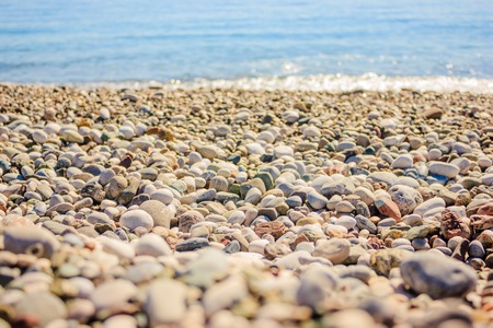 Mediterranean landscape in Antalya, Turkey. Blue sea, waves and pebble beach