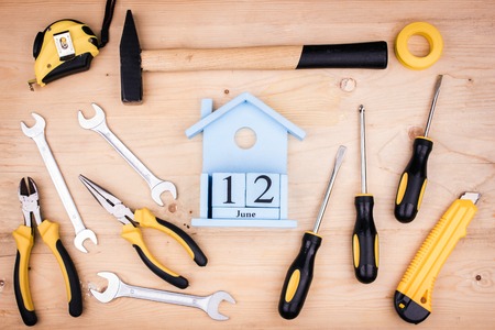 June 12 - Father's Day. Male concept. Repair tools - hammer, screwdrivers, adjustable wrenches, pliers. Sheet of a white paper.の写真素材