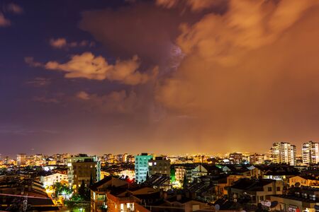 Night stormy sky with flash of lightning over the city - Antalya, Turkey, 06.08.2019