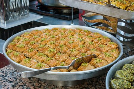 Traditional Turkish sweets baklava at the open buffet in a hotel in Turkeyの写真素材