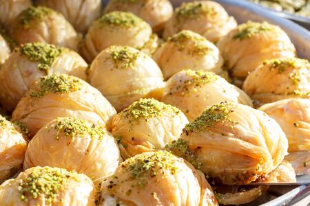 Traditional Turkish sweets baklava at the open buffet in a hotel in Turkeyの写真素材