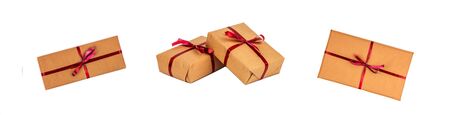 Gift Boxes in Kraft Wrapping Paper with the Red Ribbons isolated