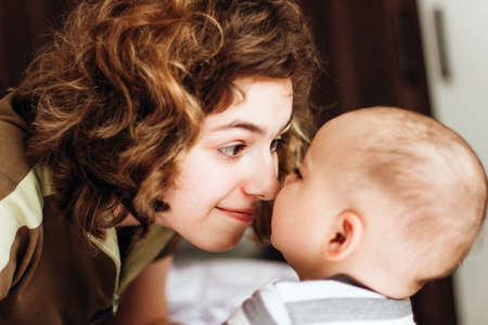 Relationsheep between siblings. Baby brother with his big sister. Baby boy and teenager girlの写真素材