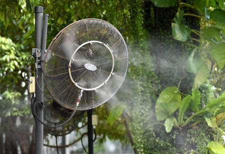 The mist fan that is spraying the mist makes the air cool.