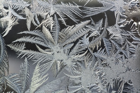 The abstract frosty pattern on glassの写真素材