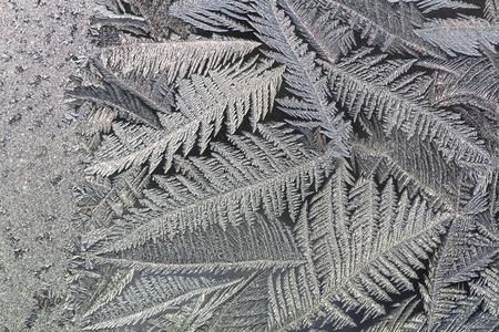 The abstract frosty pattern on glassの写真素材