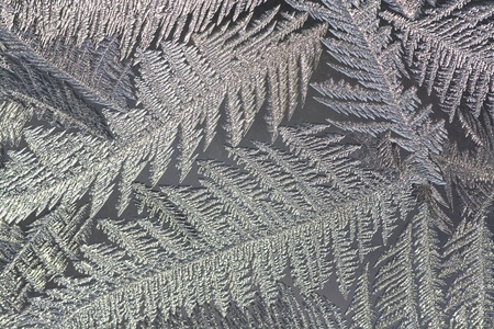 The abstract frosty pattern on glassの写真素材
