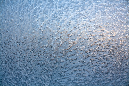 The abstract frosty pattern on glassの写真素材