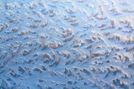 The abstract frosty pattern on glassの写真素材