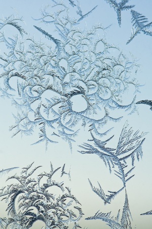 The abstract frosty pattern on glassの写真素材