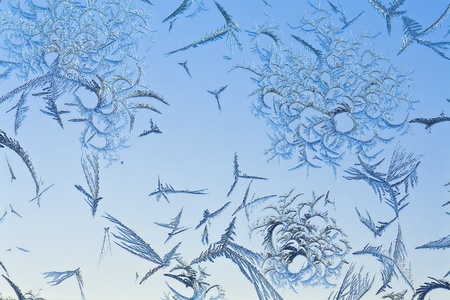 The abstract frosty pattern on glassの写真素材
