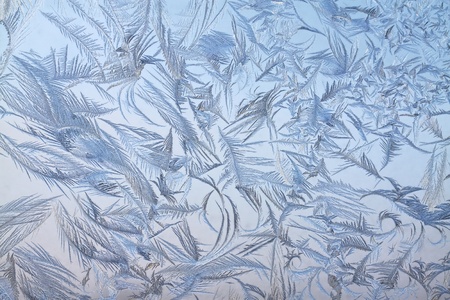 The abstract frosty pattern on glassの写真素材